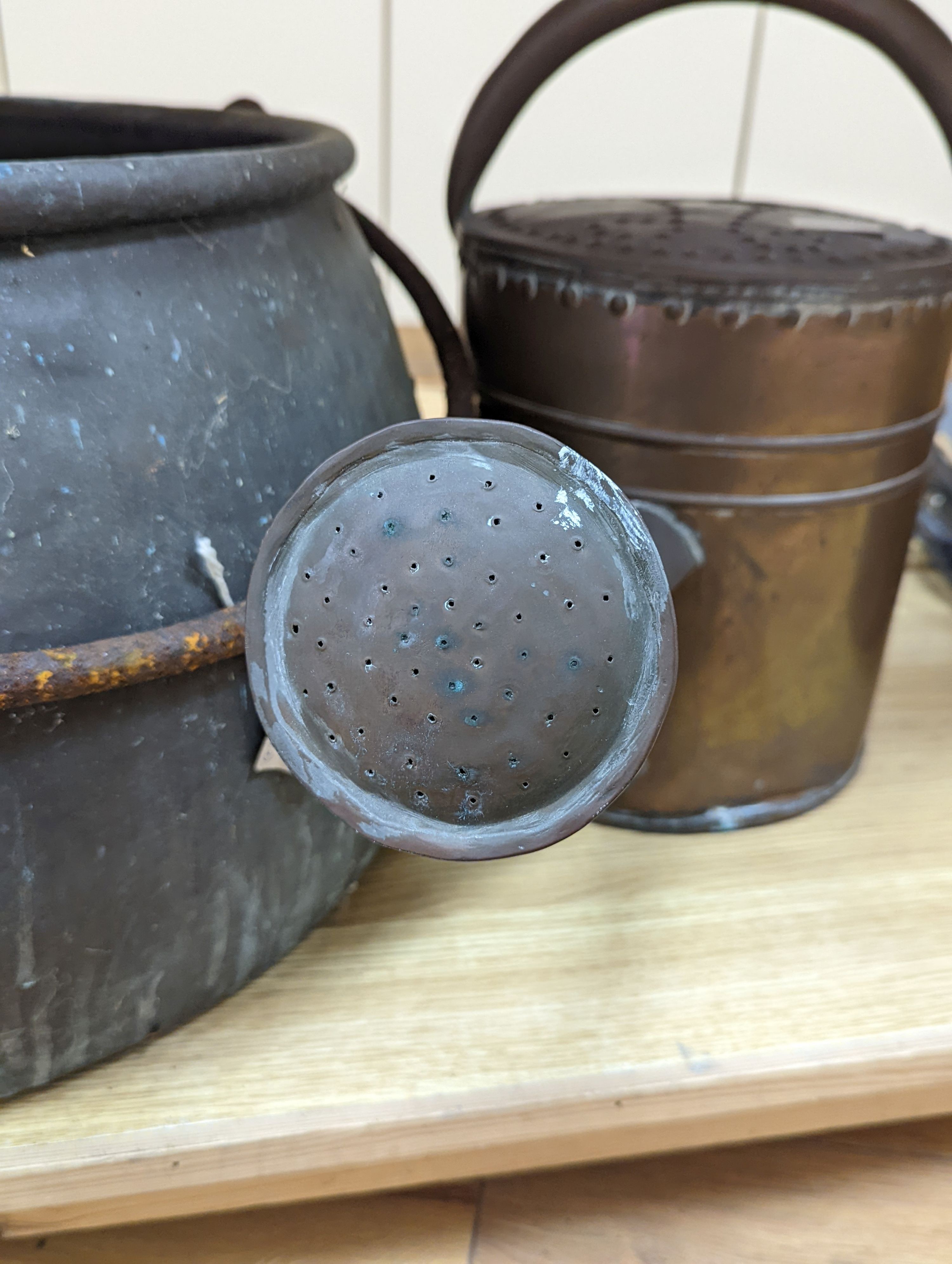 A large copper cauldron, 54cm wide and watering can